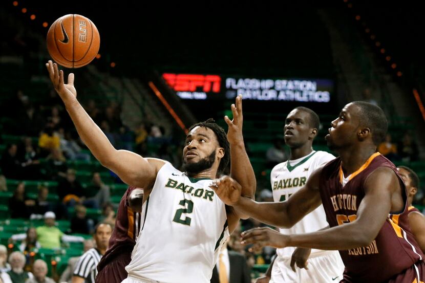 Baylor's Rico Gathers (2) grabs an offensive rebound in front of Huston-Tillotsons Chris...