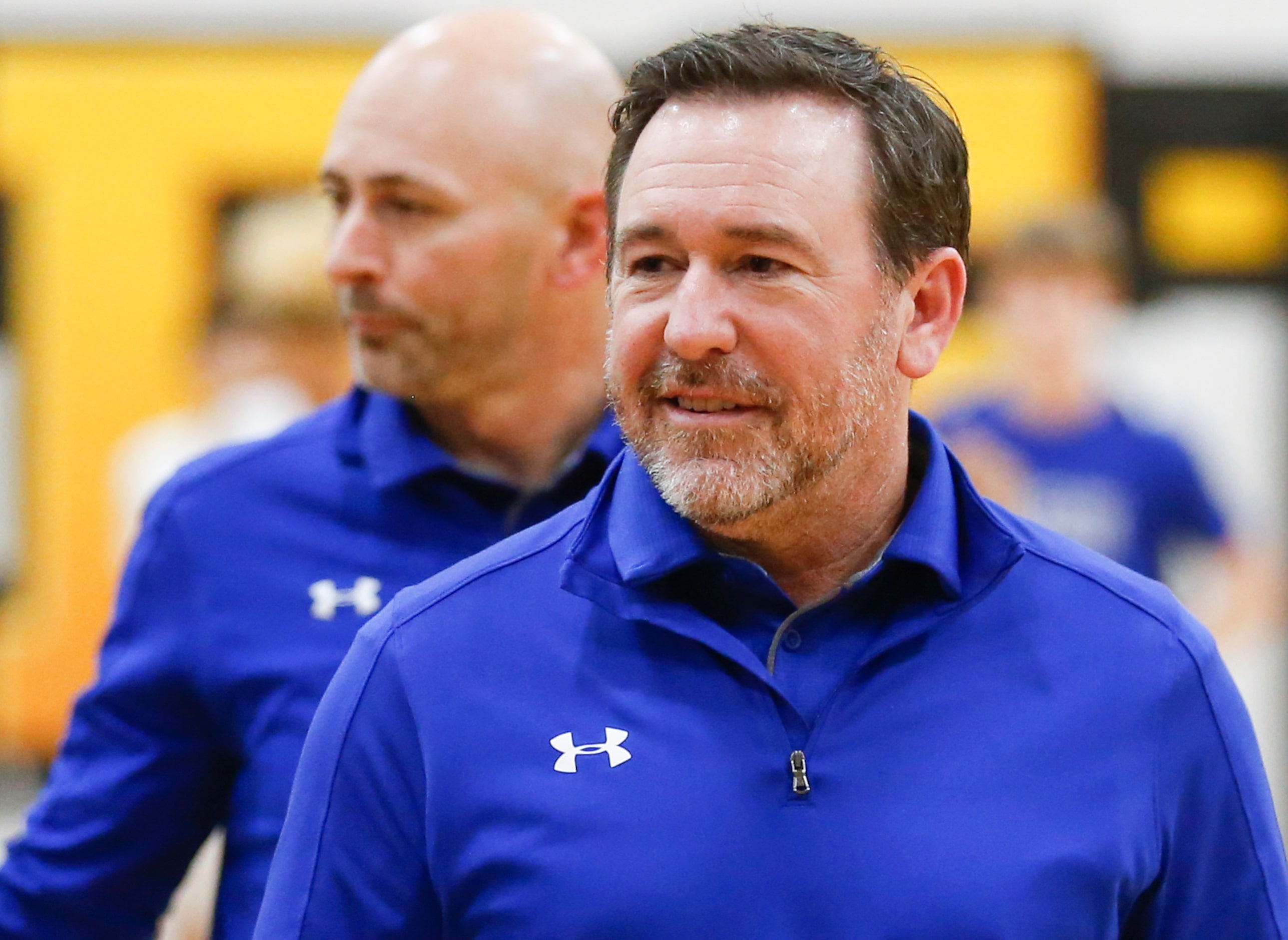 Byron Nelson High School head coach Scott Curran walks off the court after the game at...