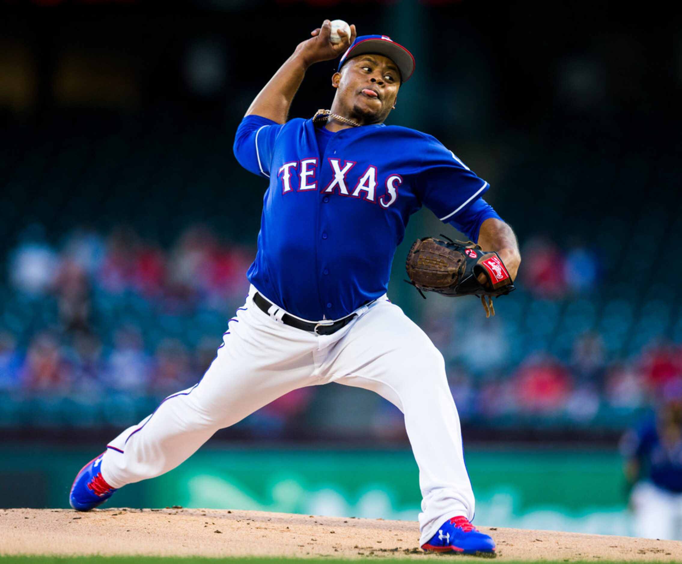 Texas Rangers starting pitcher Edinson Volquez (36) pitches during the first inning of a...