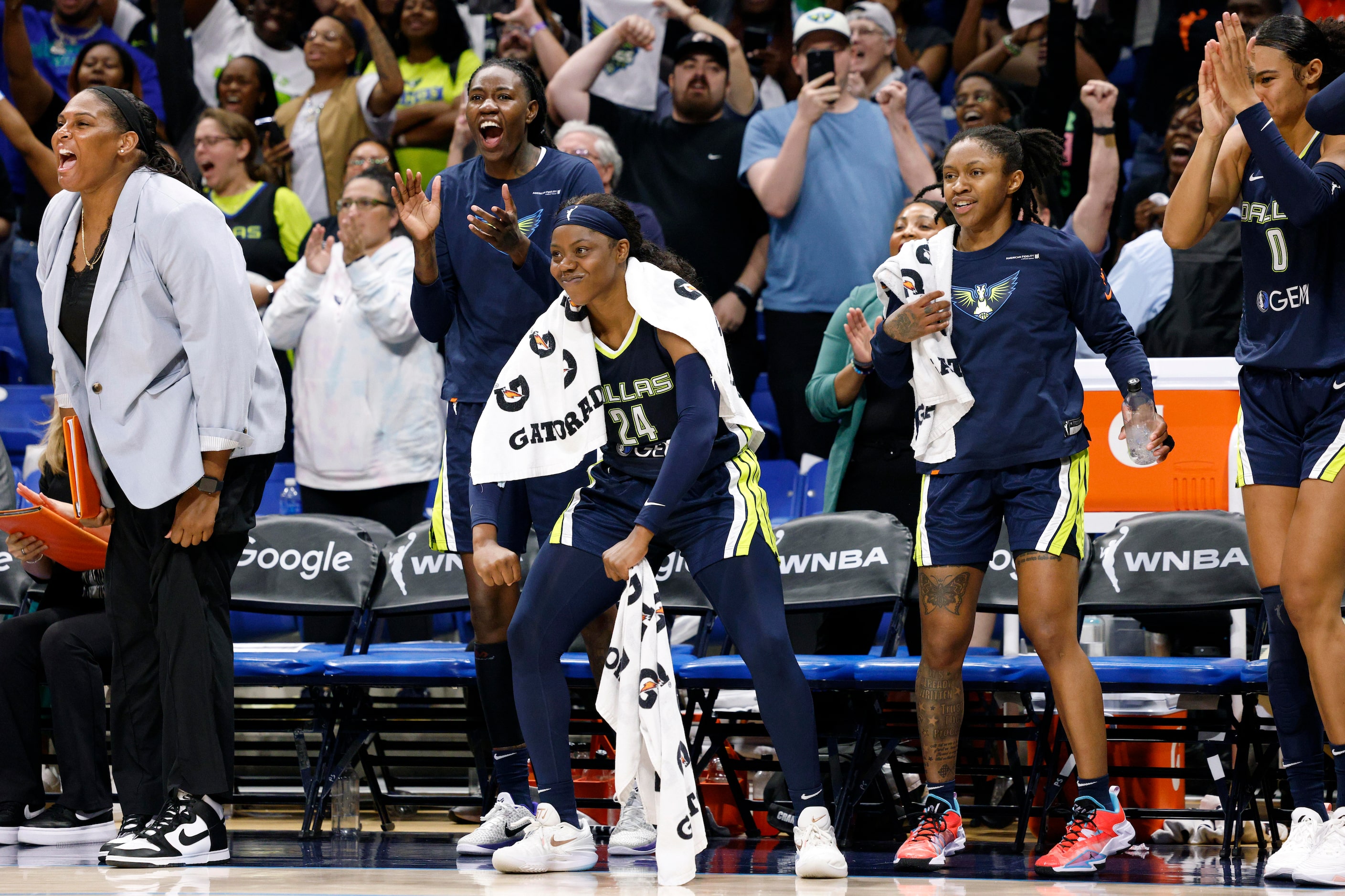 Dallas Wings guard Arike Ogunbowale (24) celebrates a WNBA first-round playoff series win...