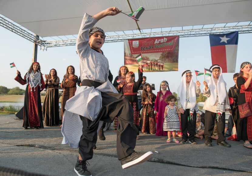 Children model clothing from Palestine during the 2017 Texas Arab Festival.