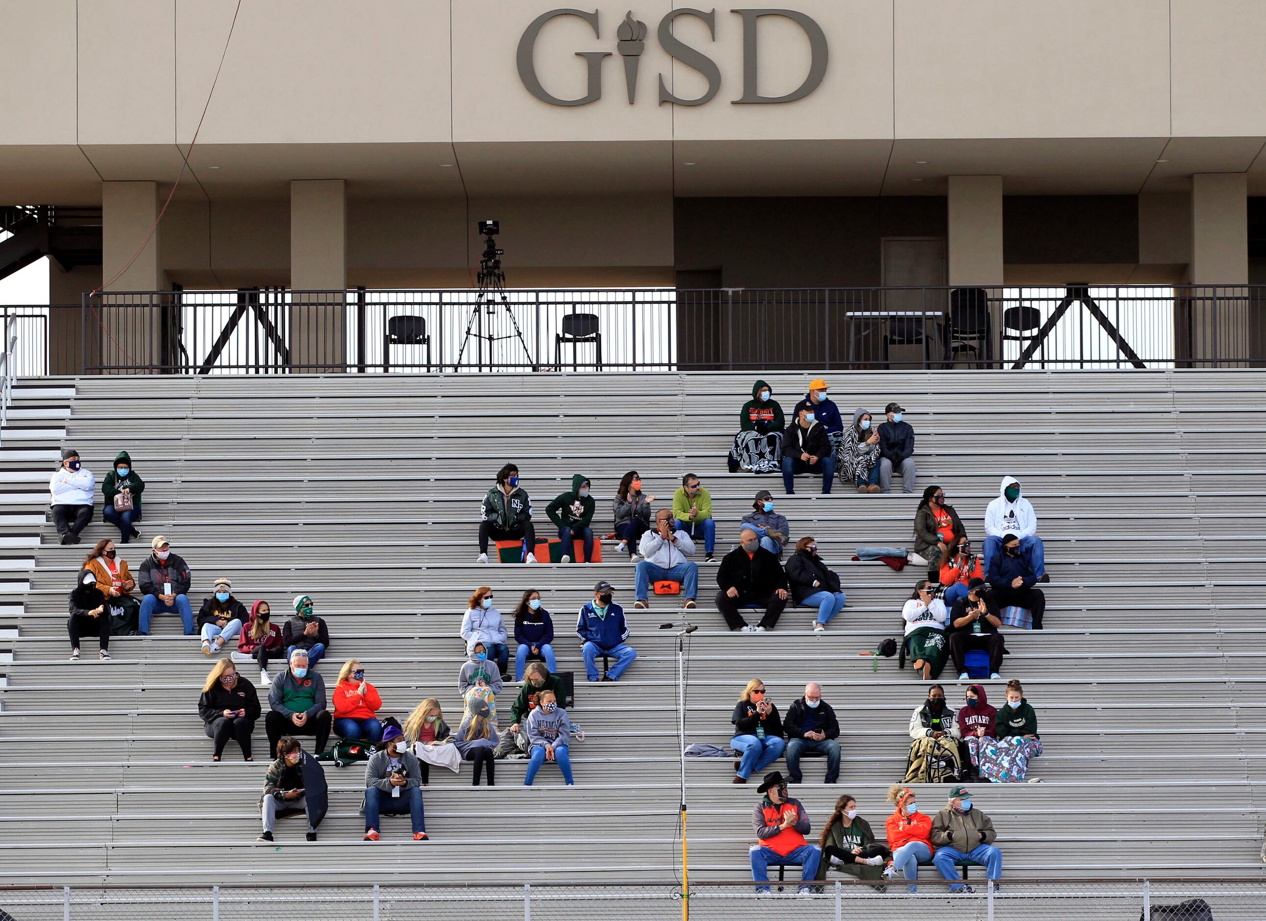 The Naaman Forest fans spread out in the stands during the first half of a high school...