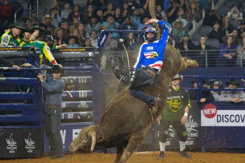 Bull rider Cody Teel of Team U.S.A. Eagles rides Cochise during the PBR Global Cup at AT&T...