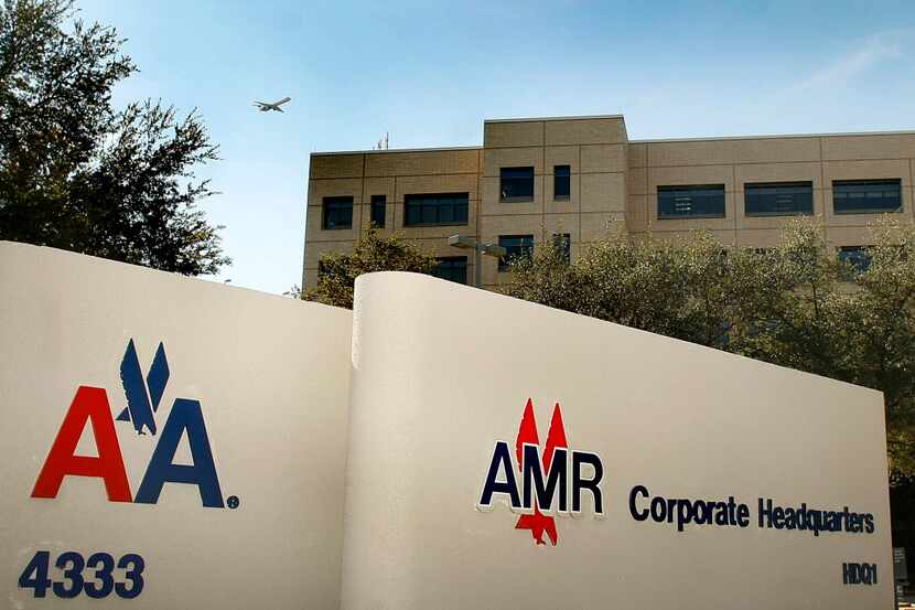  A plane flies over American Airlines Inc. and parent company AMR Corp. outside of AMR Corp....