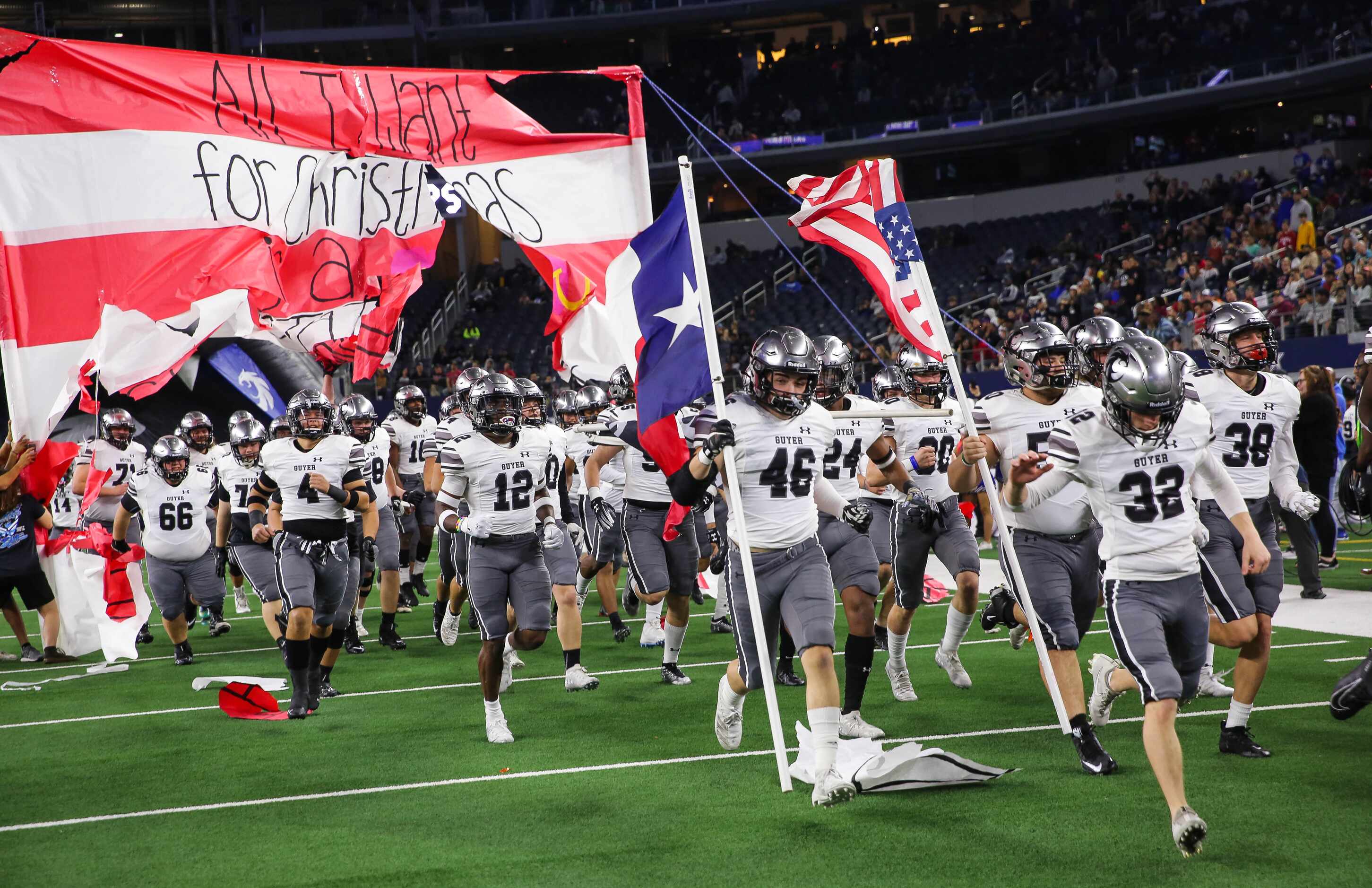 Denton Guyer runs out before a Class 6A Division II state championship game against Austin...
