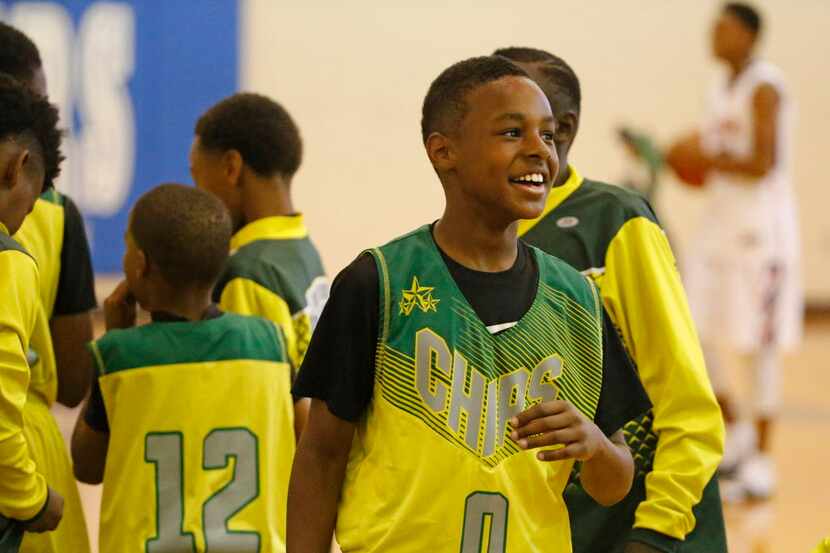 LeBron James Jr. is all smiles after the Gulf Coast Blue Chips basketball team won their...