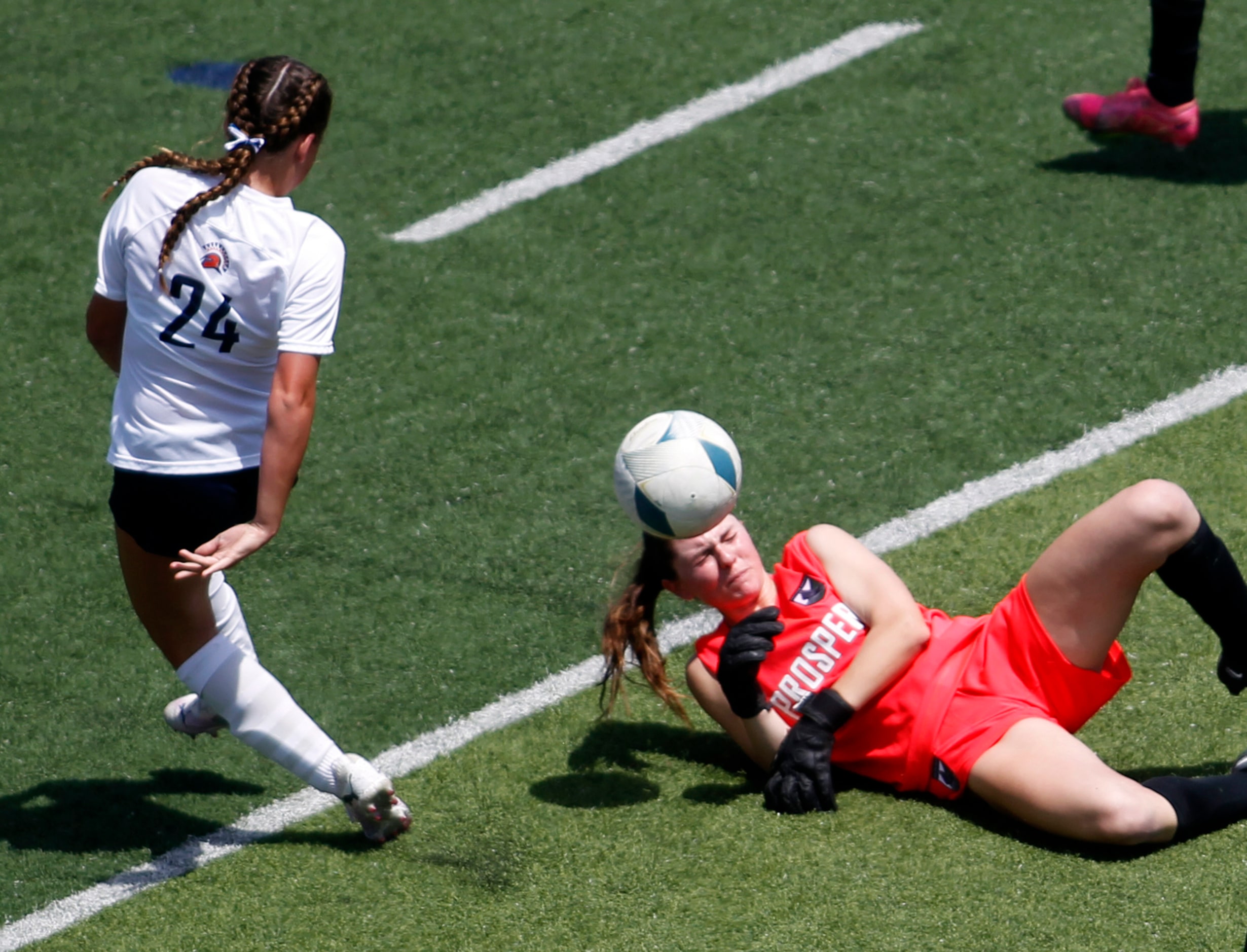  Prosper goalkeeper Maggie Manning (1), lower right, makes a diving save well out in front...