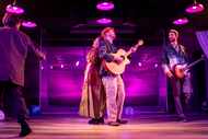 Aubrey and Ian Ferguson, flanked by members of the band in Circle Theatre's production of...