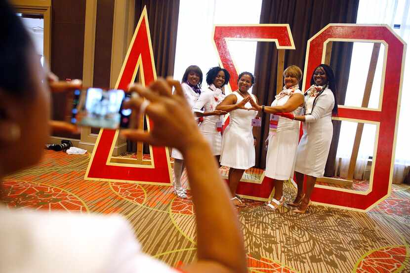 A group of Delta Sigma Theta Sorority members pose with the greek letters at their regional...