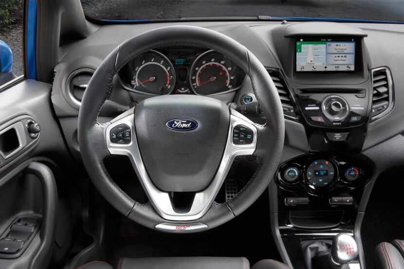 
The interior of the 2015 Ford Fiesta ST has a busy center stack, but most everything is...
