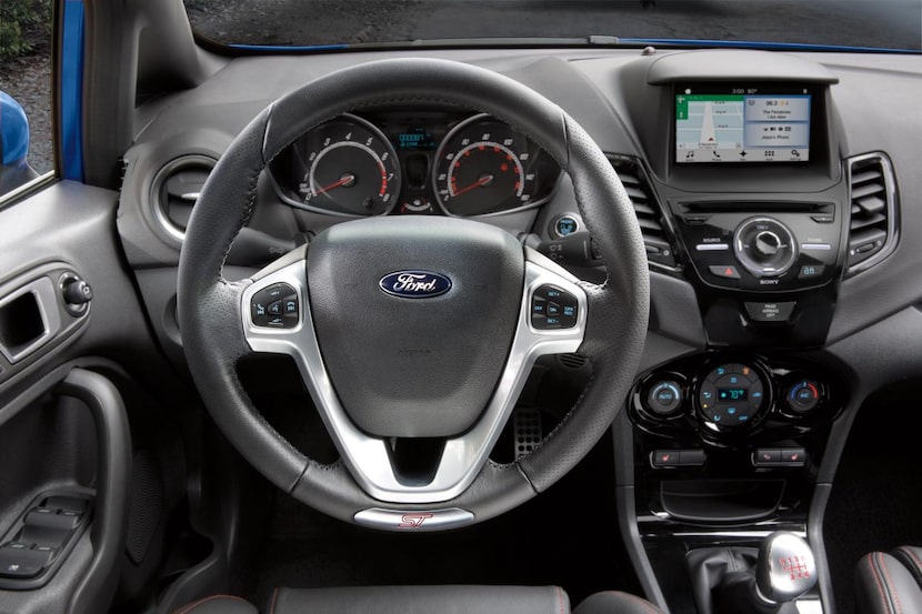 
The interior of the 2015 Ford Fiesta ST has a busy center stack, but most everything is...