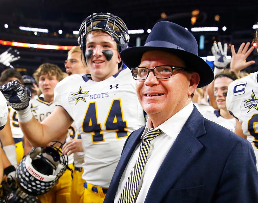 Highland Park head football coach Randy Allen celebrates with his players after defeating...