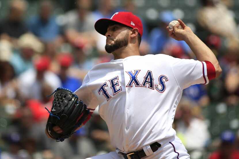 ARLINGTON, TX - MAY 18: Martin Perez #33 of the Texas Rangers pitches against the...