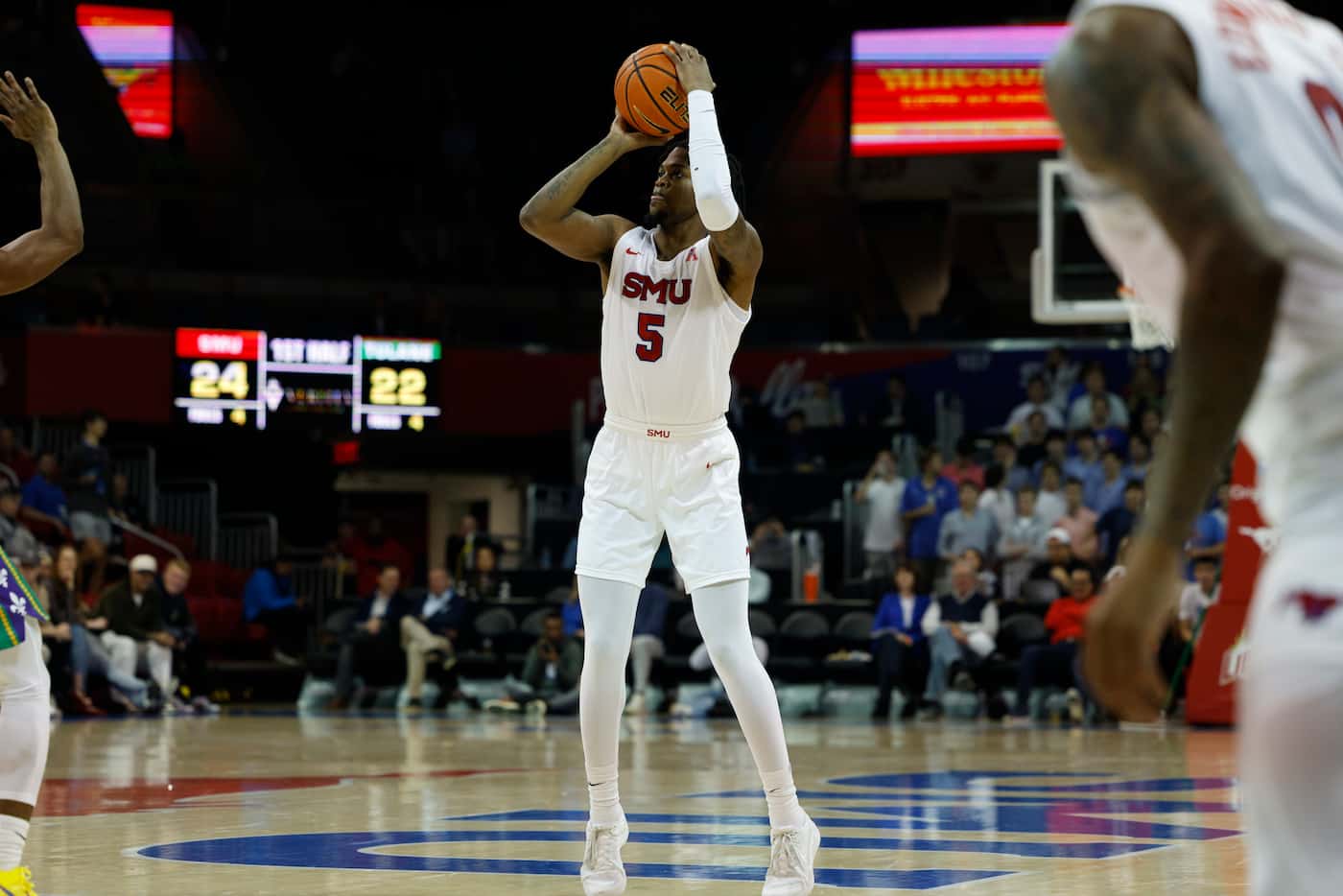 SMU guard Ricardo Wright (5) shoots a three-pointer during the first half of an NCAA...
