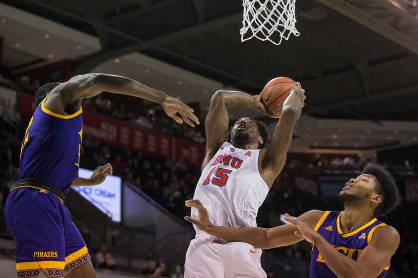 Southern Methodist Mustangs forward Isiaha Mike (15) goes up for a shot past East Carolina...