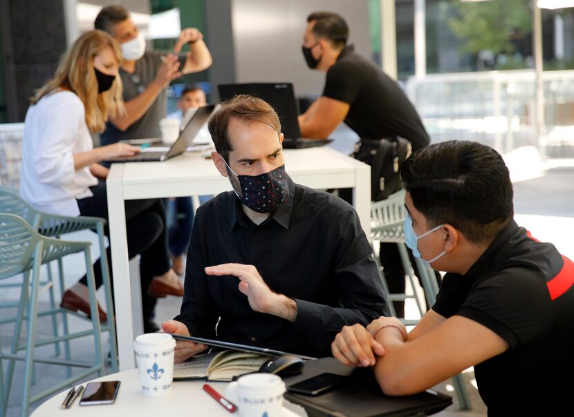 HKS Associate Robert Casasus (center) visited with designer Francisco Barron about an...