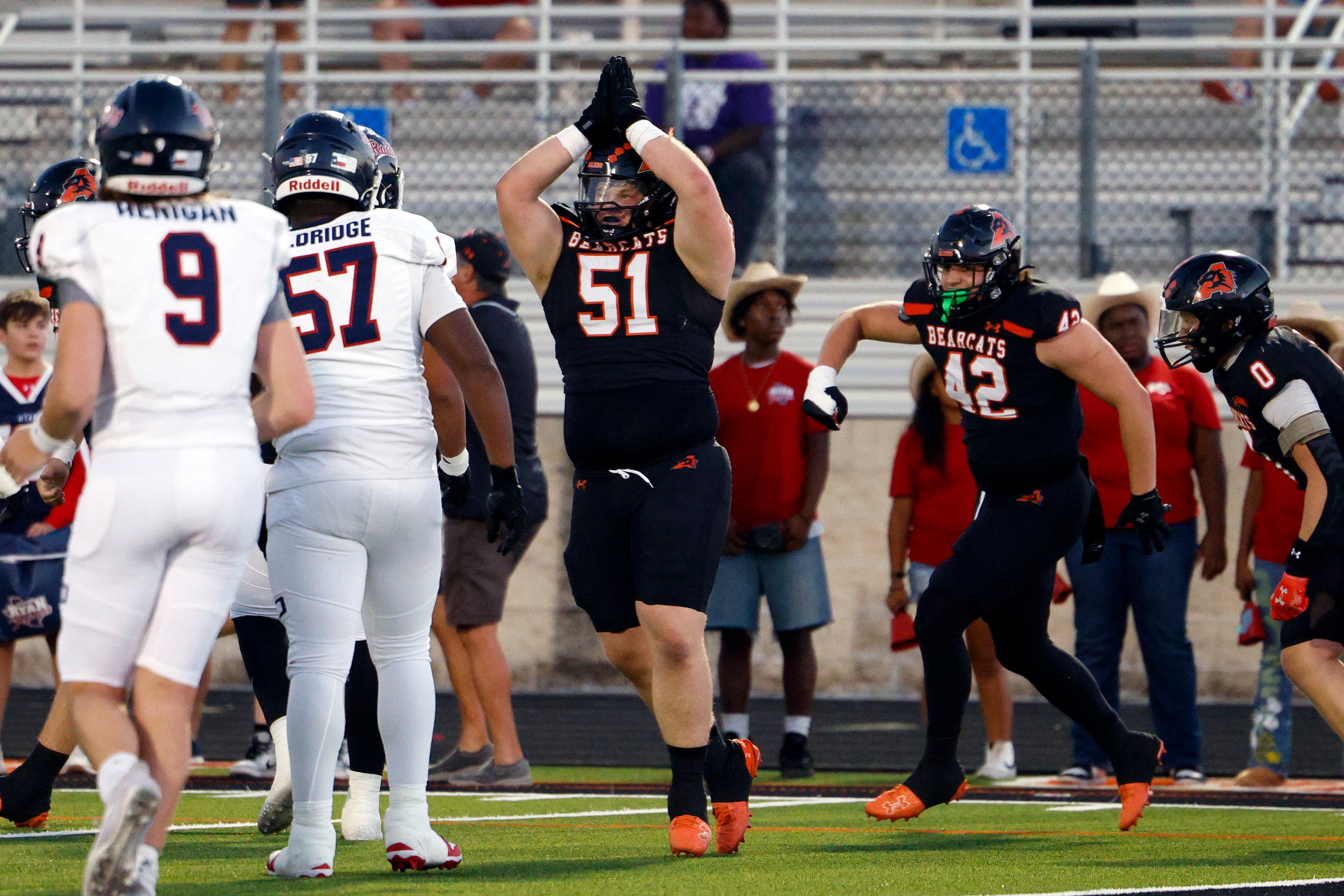 Aledo defensive lineman Decker Sanders (51) celebrates after forcing a Denton Ryan safety...