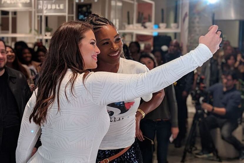 Serena Williams and model Ashley Graham take a selfie in front of the waiting crowd....