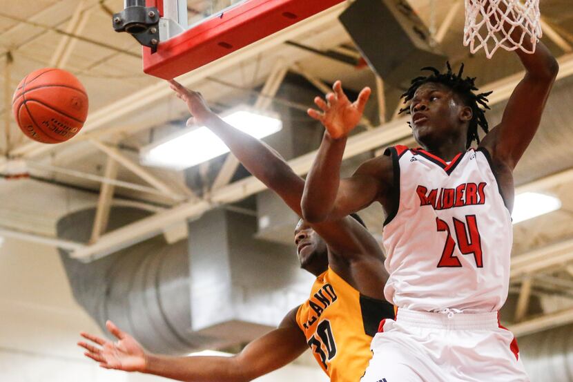 Garland High School Chukes Ejiofor (30) and North Garland High School Augustine Chibuko (24)...