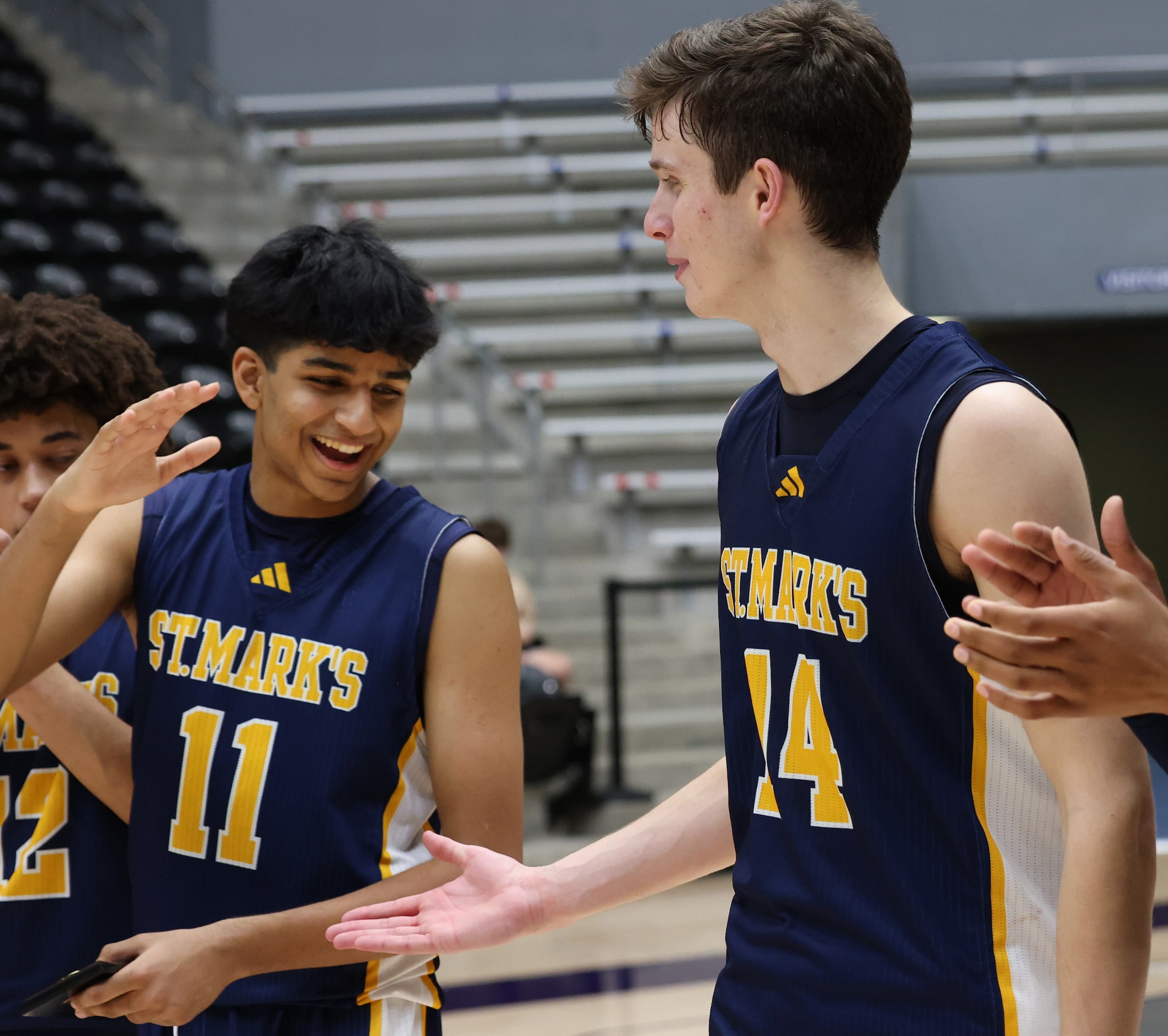 St. Mark's guard Luke Laczkowski (14), right, is congratulated by teammate Pranav Danda (11)...