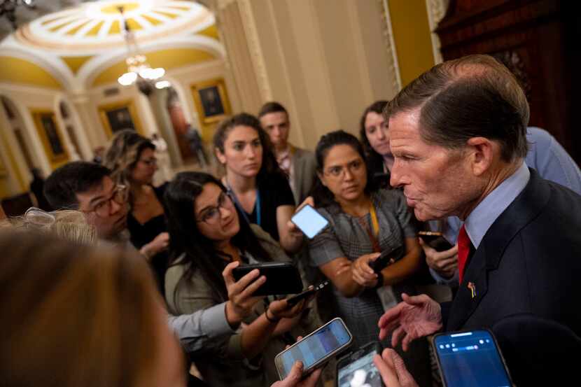 Sen. Richard Blumenthal, D-Conn., speaks to reporters as he walks out of a closed-door...