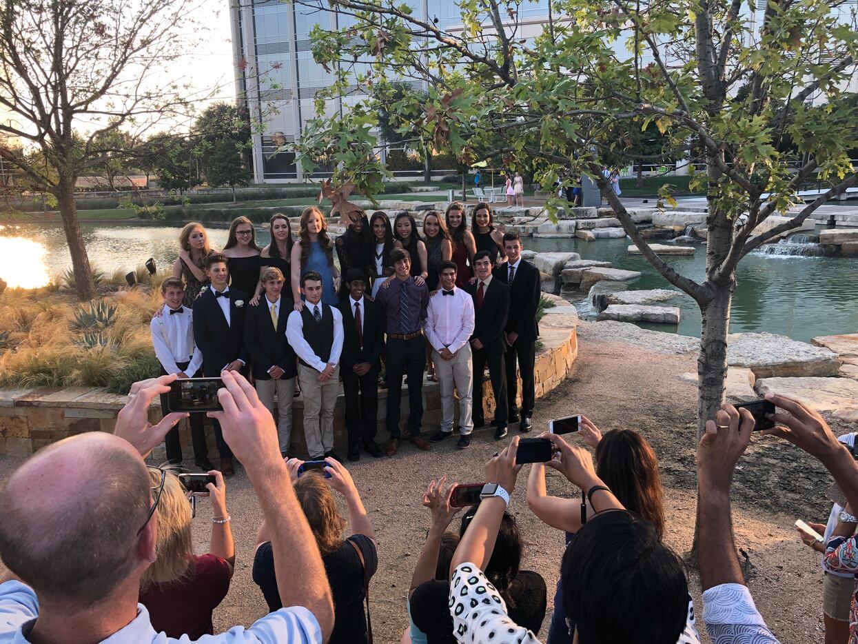 Parents take photos for homecoming (well, technically it's forthcoming, since the students'...