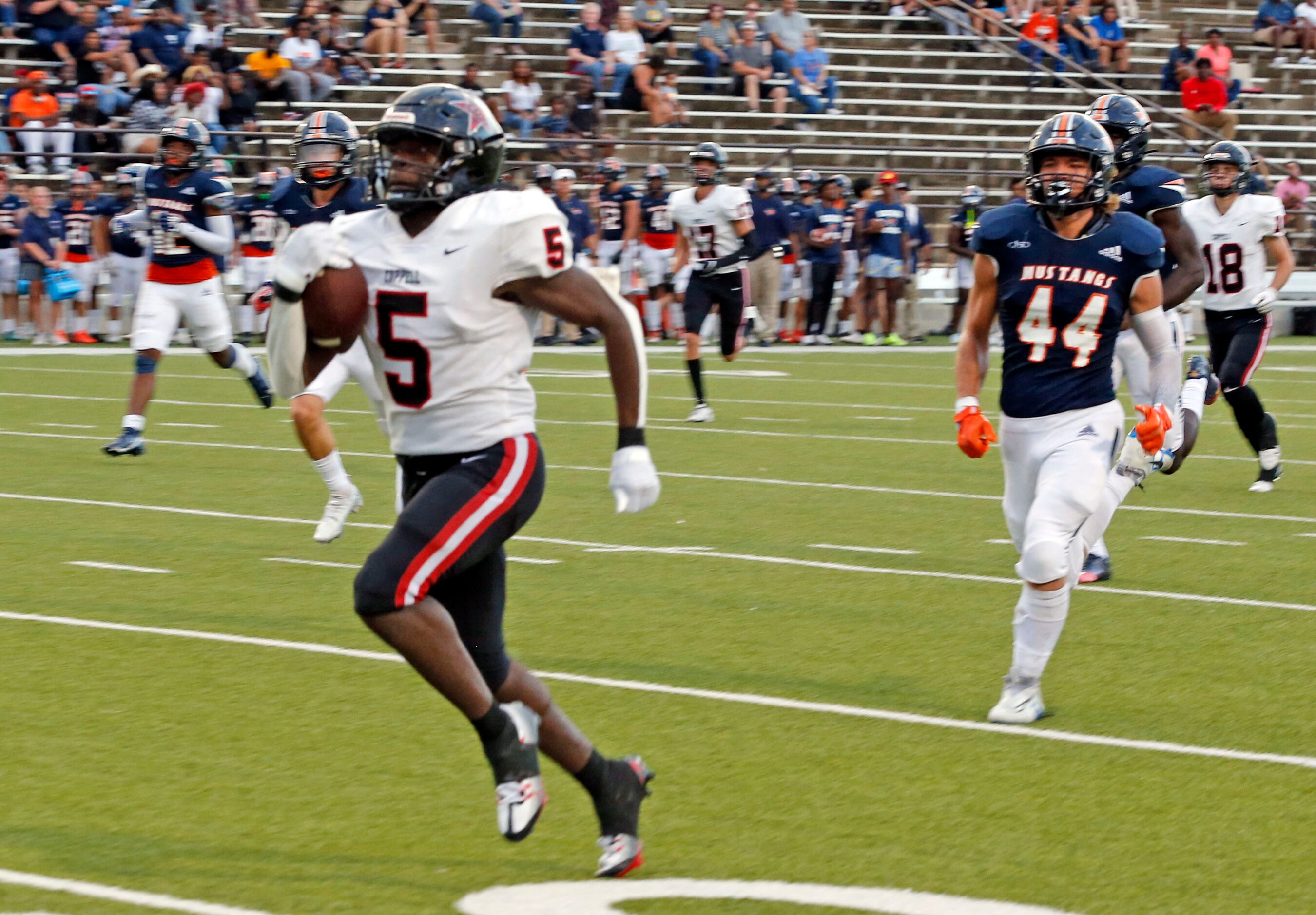 Coppell Rb Malkam Wallace (5) outraces the Sachse defense, as he heads to the end zone for a...