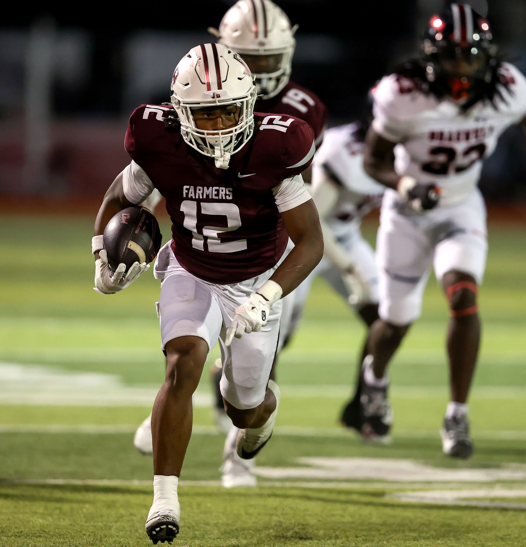 Lewisville wide receiver Derrick Martin (12) has lots of room to run after making a...