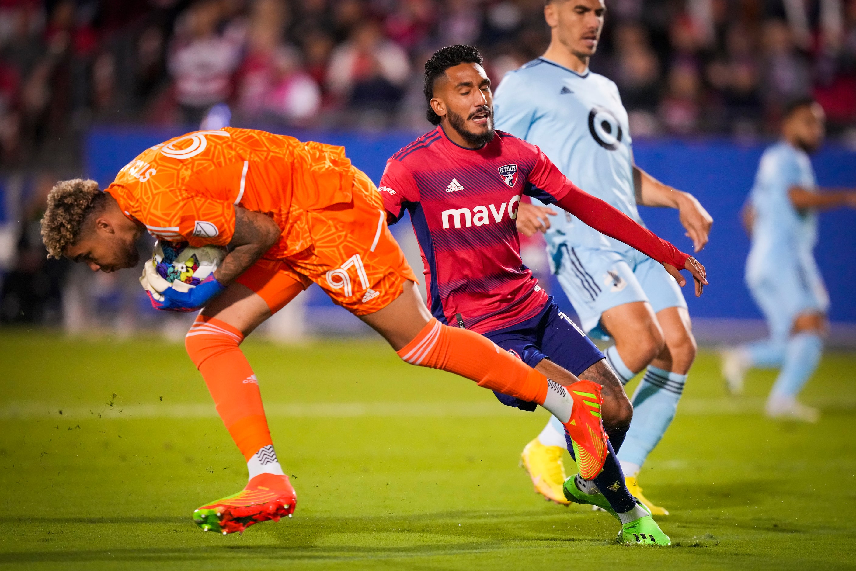 Minnesota United goalkeeper Dayne St. Clair (97) takes a ball away from FC Dallas forward...