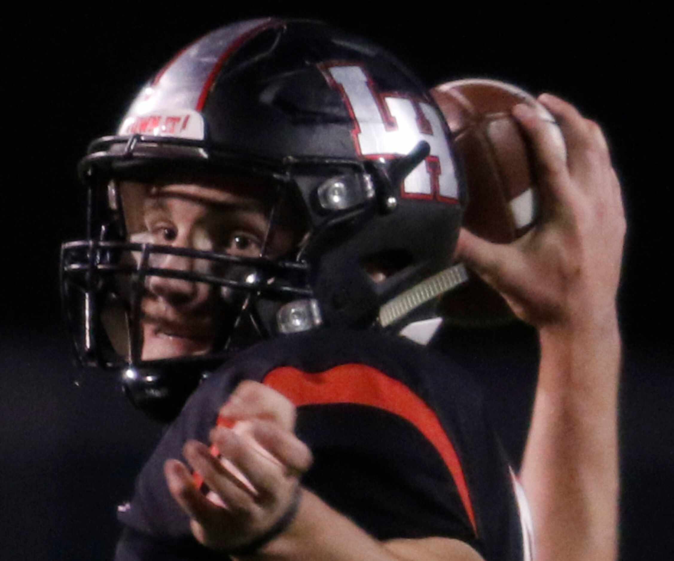 Lake Highlands quarterback Mitch Coulson (6) eyes a receiver as he launches a first half...