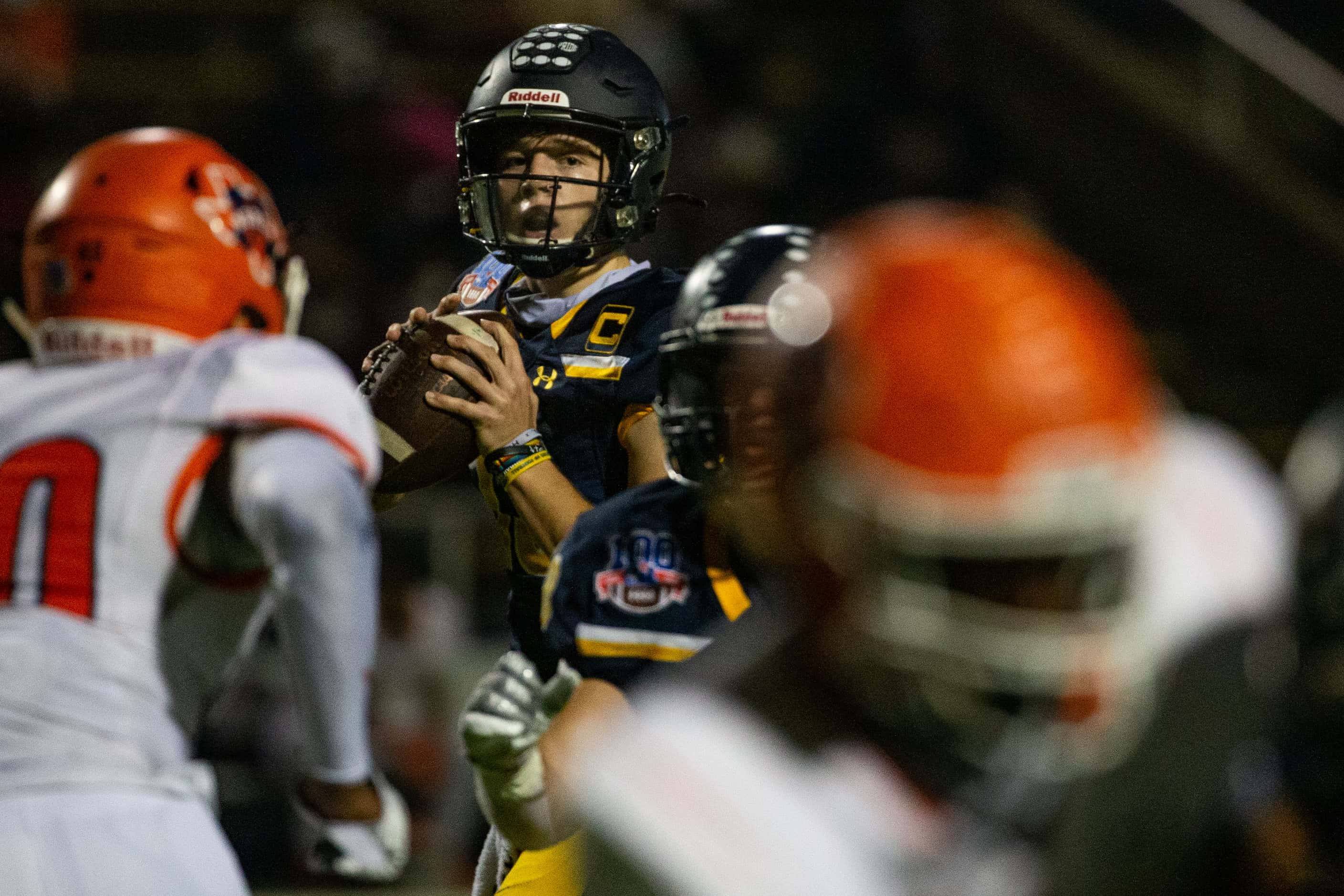 Highland Park quarterback Brayden Schager (13) looks to make a pass during the first half of...