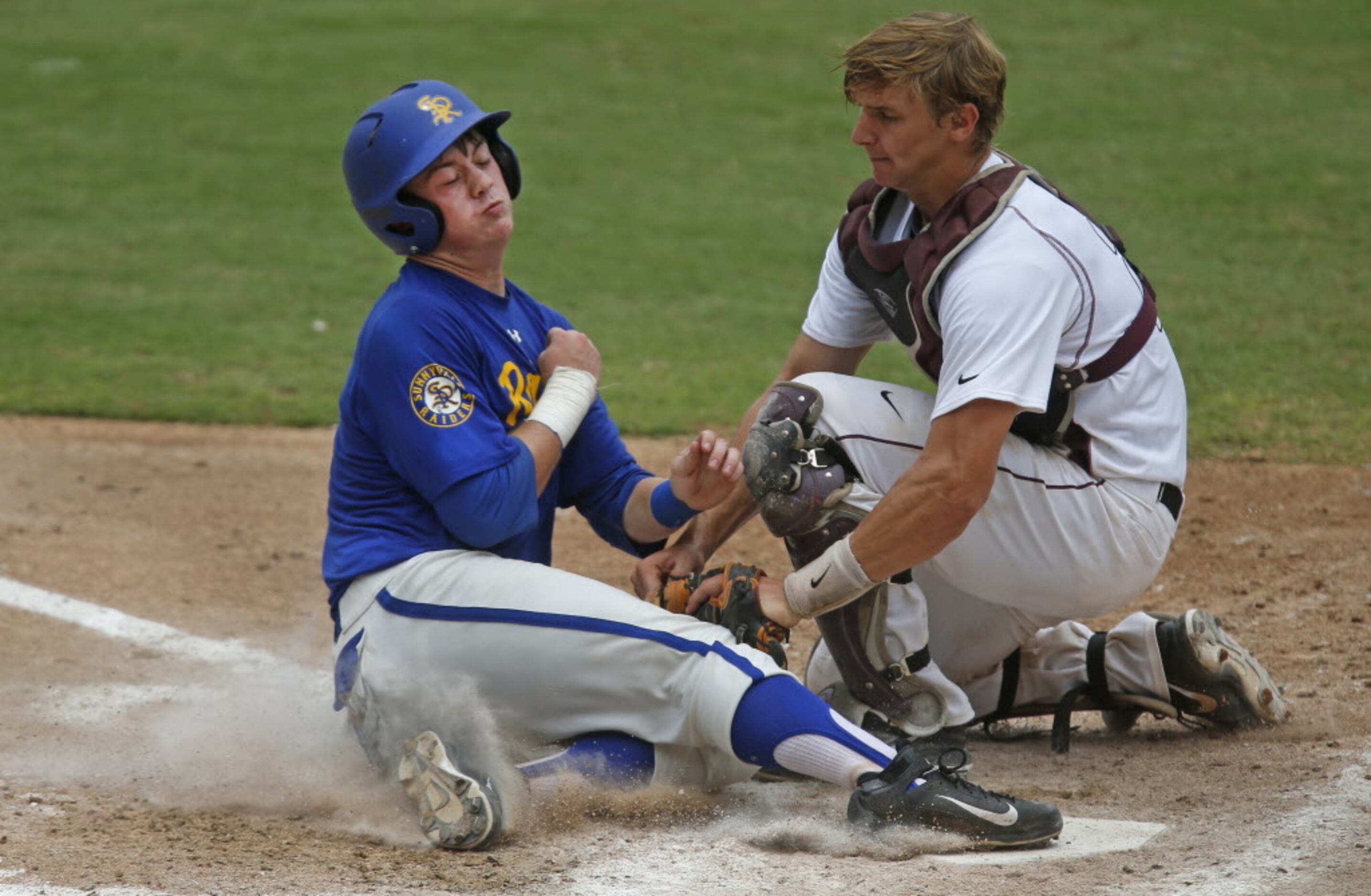 Sunnyvale's Wesley Phillips slides home safely with a run in the fourth inning as Troy...