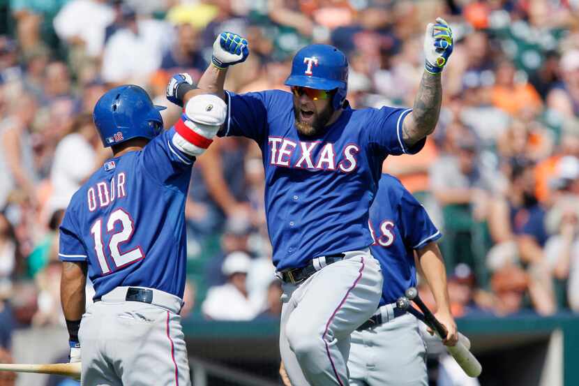 Texas Rangers' Mike Napoli celibates with Rougned Odor after hitting a solo home run against...