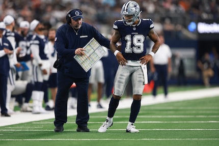 Dallas Cowboys head coach Mike McCarthy, left, talk to quarterback Trey Lance during the...