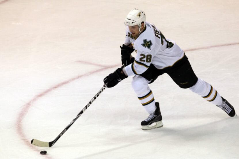 Dallas Stars defenseman Mark Fistric (28) recovers a loose puck during first period NHL ice...