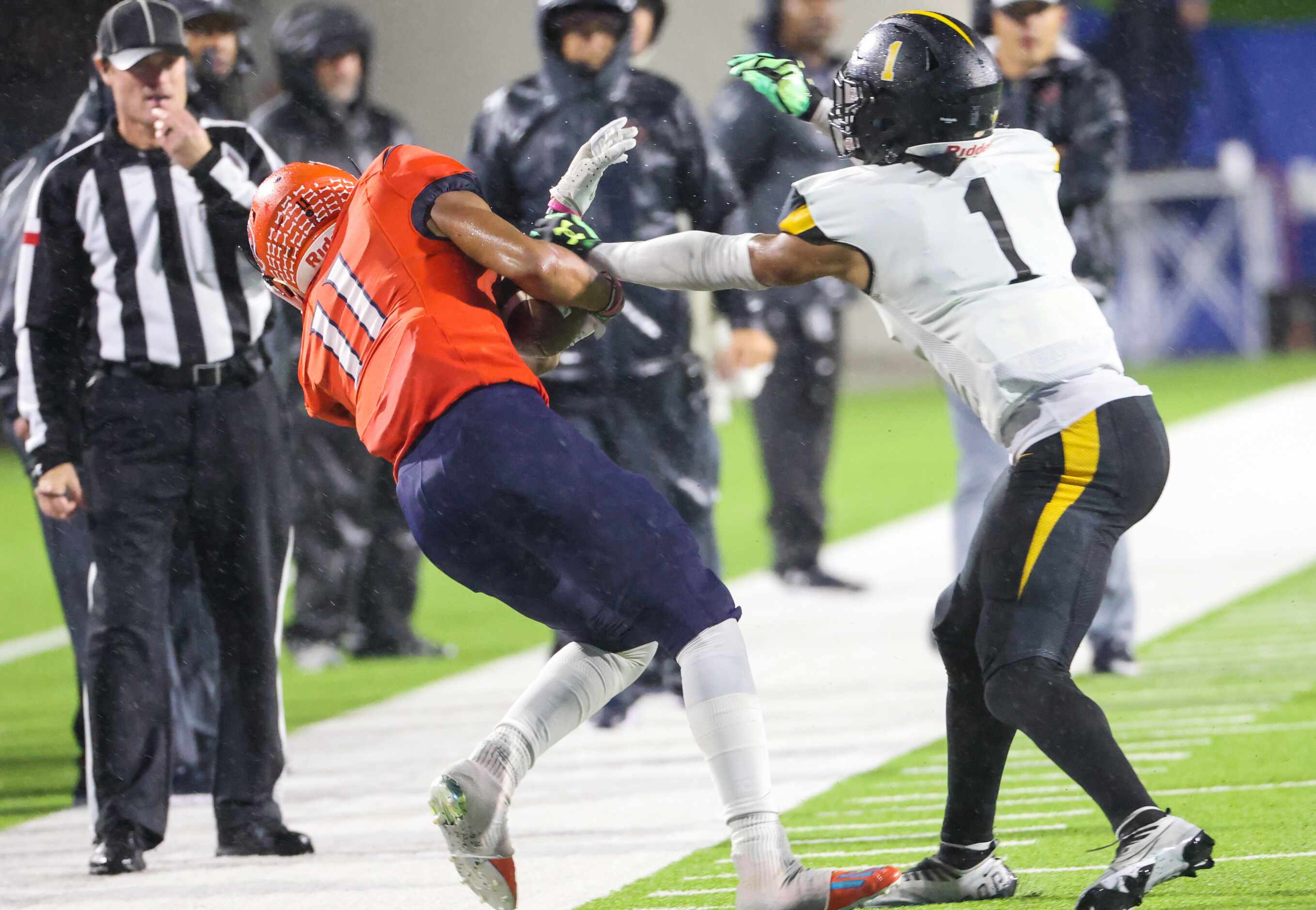 McKinney North wide receiver Korbin Hendrix (11) is pushed out of bounds by Forney defensive...