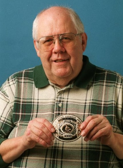 DMN sports editor/reporter Ed Knocke shows off his award from the Professional Rodeo Circuit...