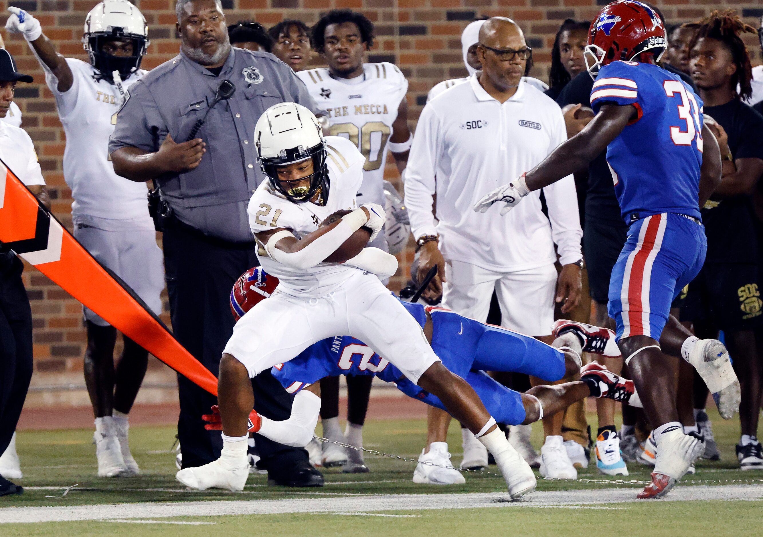 Duncanville defensive back Taj Degrate (22) forces South Oak Cliff running back Danny Green...