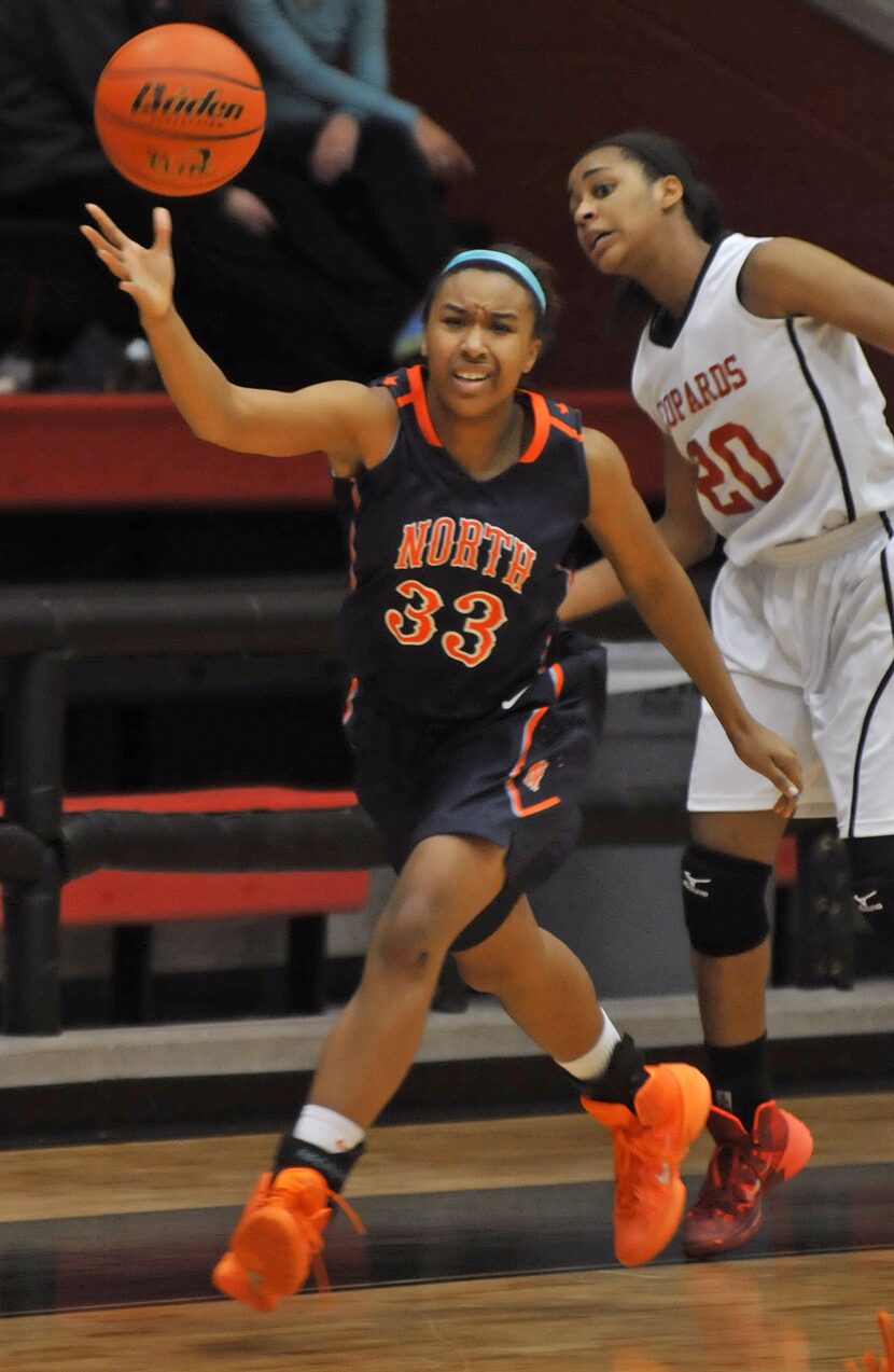 McKinney North senior Mikaehla Connor (33) captures a loose ball in front of Lovejoy senior...