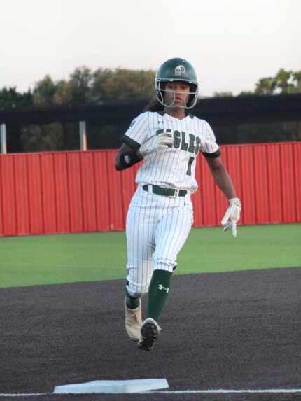 Mansfield Lake Ridge's Paris Johnson seen taking third base during a high school softball game.