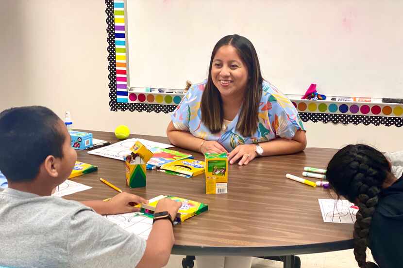 Lety Vargas, a newly hired English Language teacher in Russellville, coaches small groups of...