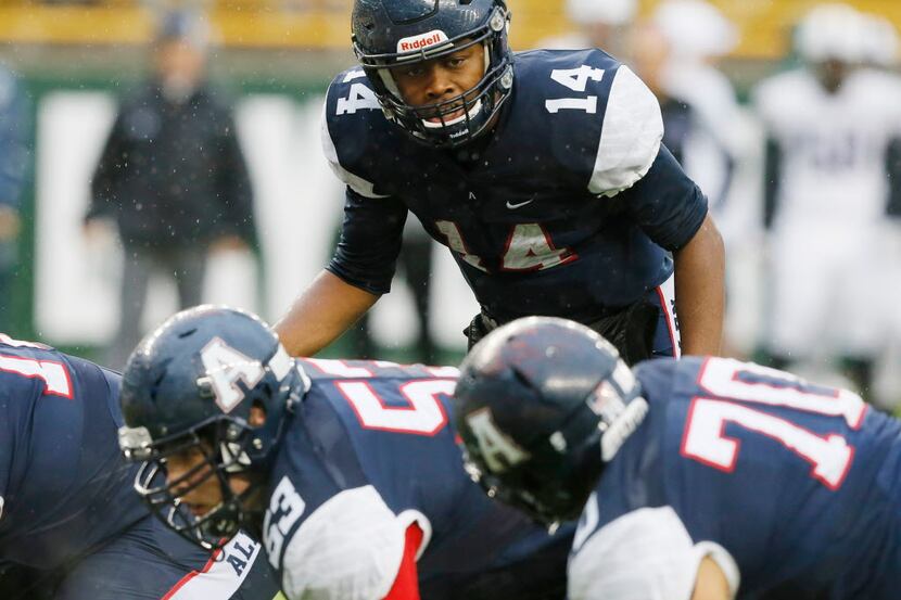 Allen Eagle quarterback Grant Tisdale (14) gives signals to the line of scrimmage during the...