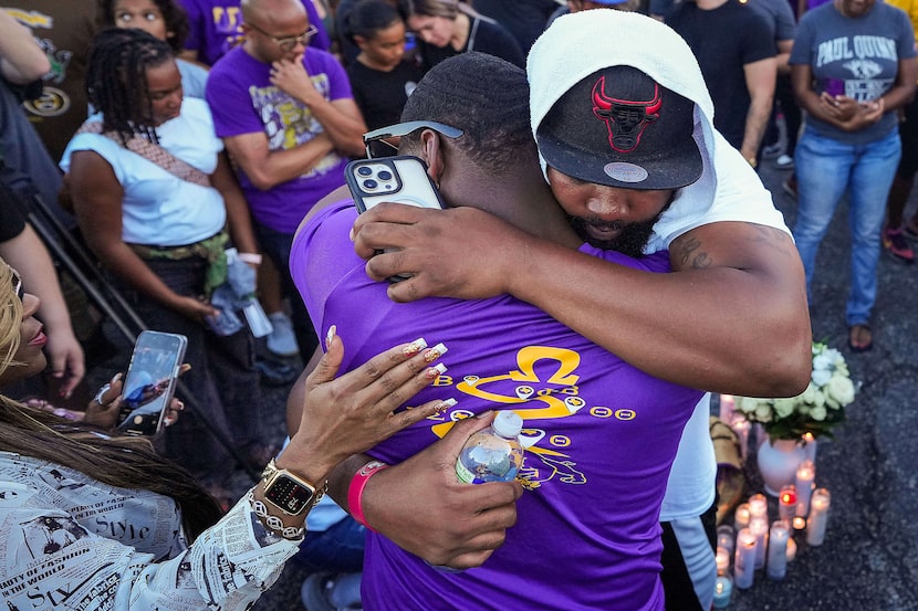 Alex Cooper (facing) and Tyrone Gonzales, who were fraternity brothers of Dallas police...