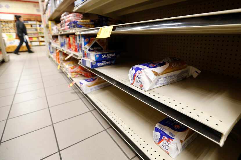 Inventory of bread in the section is low at La Michoacana Meat Market in Dallas on Saturday,...
