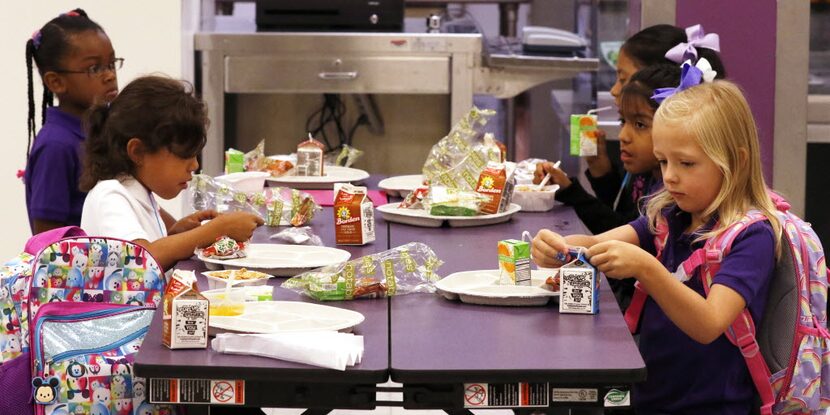 Solar Prep students eat breakfast before the first day of school on Aug. 22, 2016. 