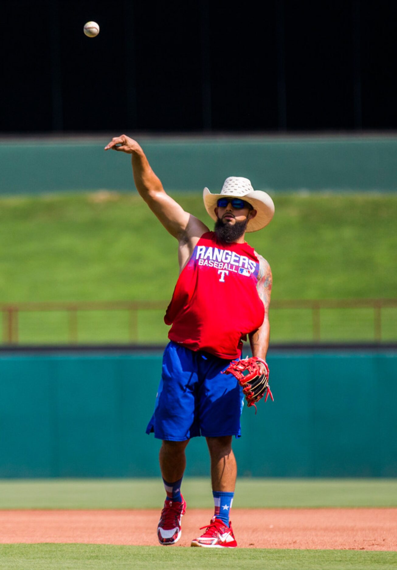 Texas Rangers second baseman Rougned Odor (12) throws a ball during batting practice before...