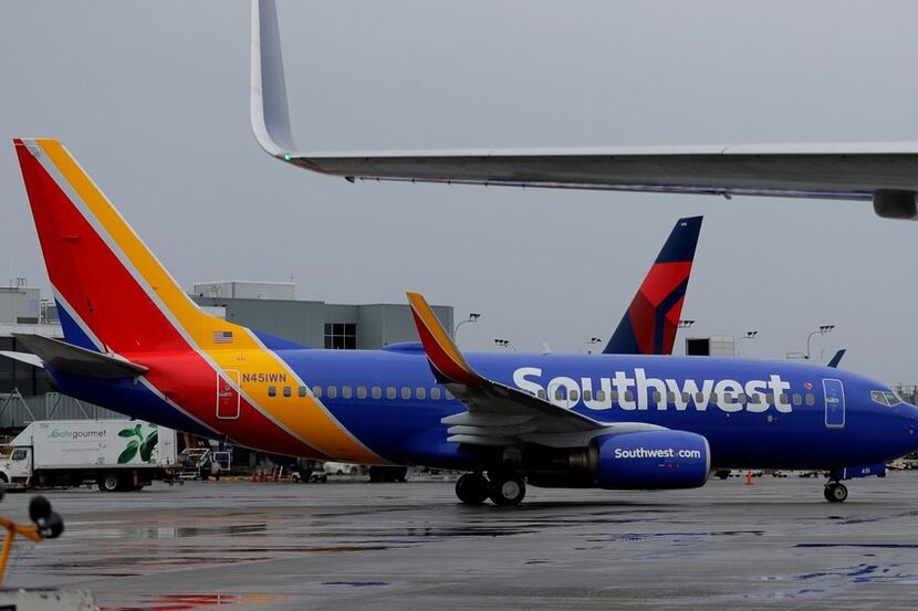 A Southwest Airlines plane taxis Friday, April 13, 2018, at the Seattle-Tacoma International...