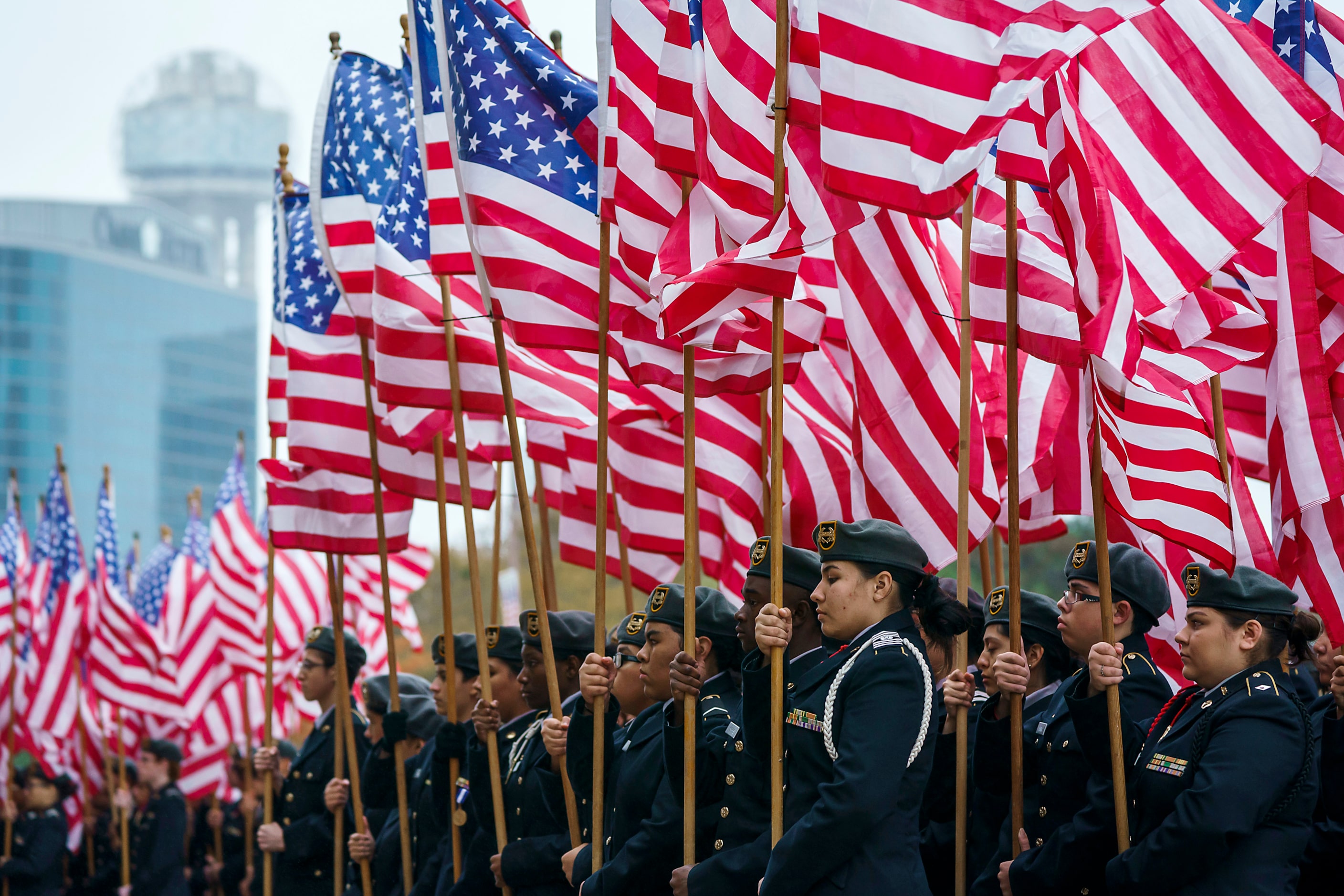 DISD JROTC cadets participate in the Massing of the Colors during an 11th hour ceremony at...