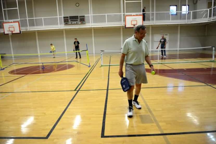 
Ed Guancial gets ready to serve in a game of pickleball at the Rowlett Community Centre. 
