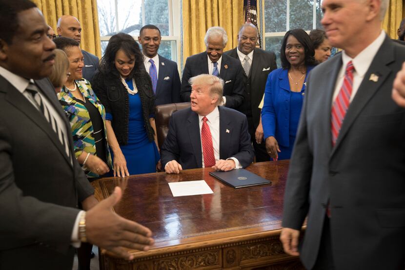 President Donald Trump signs an executive order aimed to strengthen the federal office in...